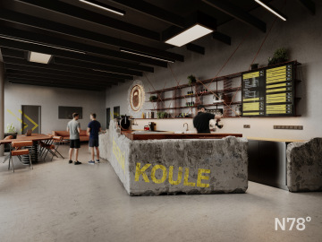 Interiér fitness Železná koule – pohled na betonovou recepci.